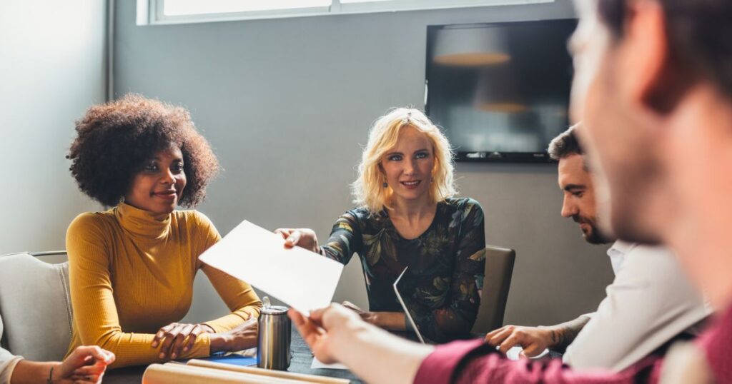 people around a table at work