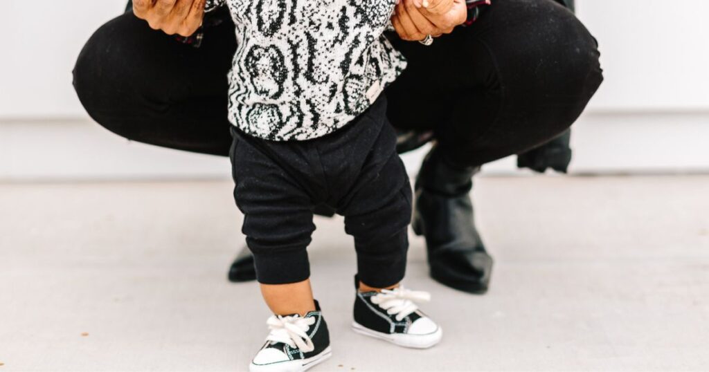 baby taking first steps